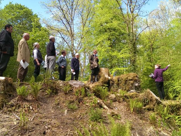 Members of the Regency restoration project steering group standing on Llyn Felin Gat dam